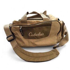 CABELA’S  NWOT tan catch all duffle bag with adjustable shoulder strap.